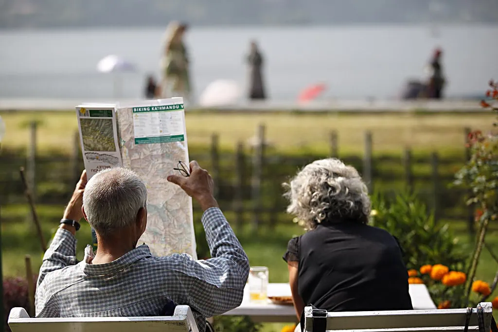 tourists reading a map in nepal
